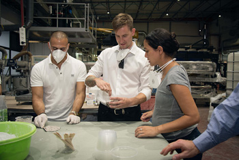 Caesarstone UK Sales Manager Sam Penny mixing some of the raw ingredients.